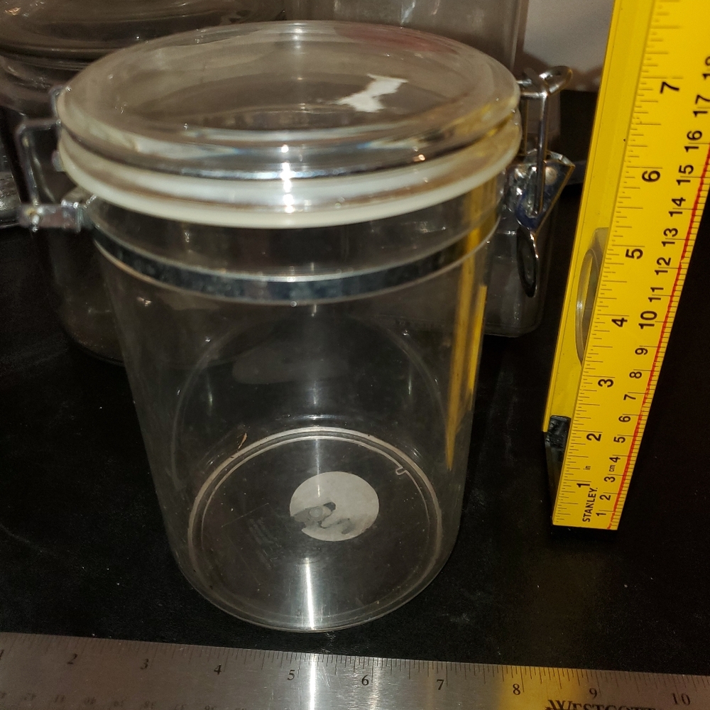 Canister with Lid. 4.5" diameter 7" tall.This is not glass,  it's  hard plasti
